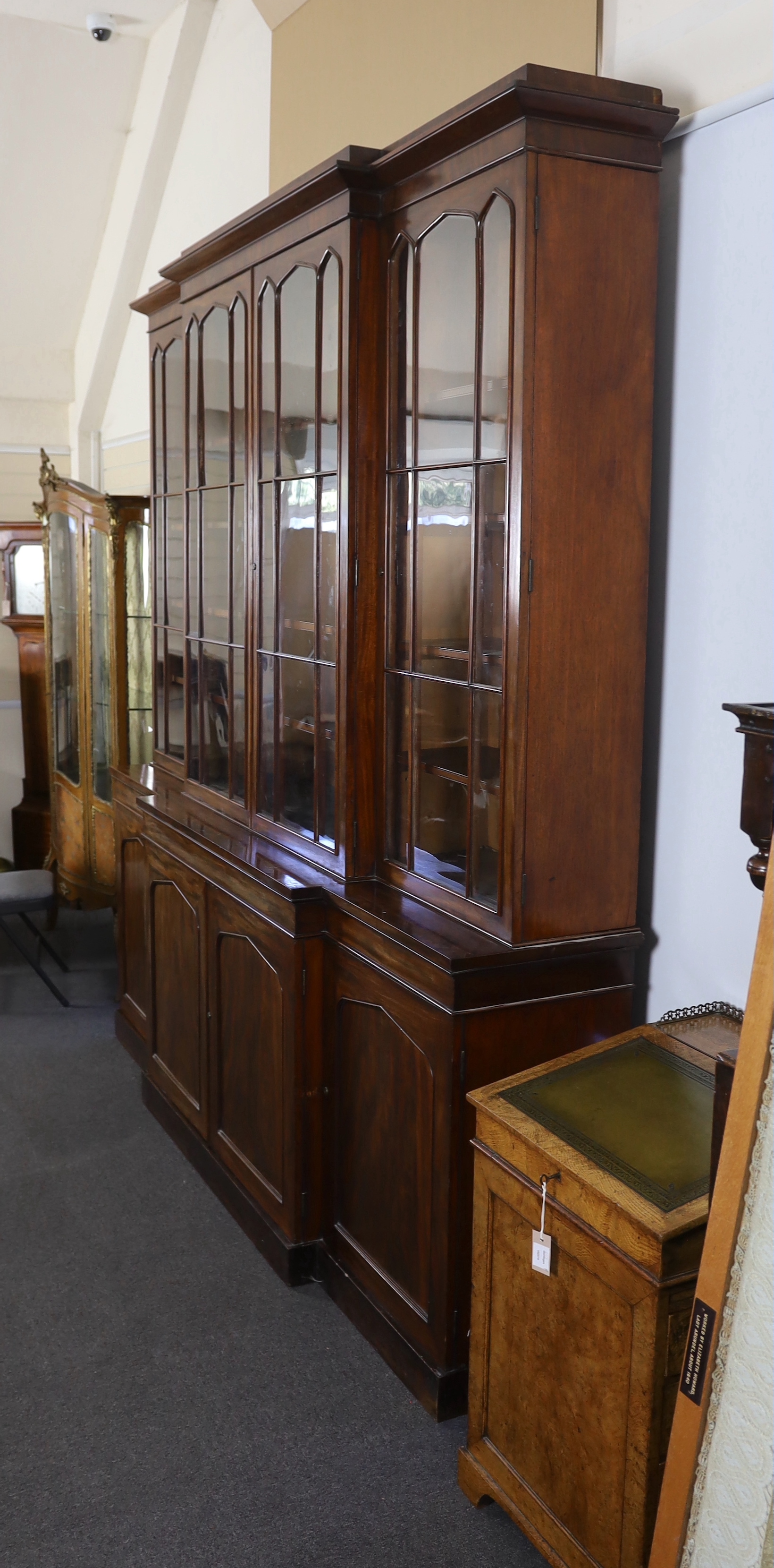 An early Victorian mahogany breakfront library bookcase